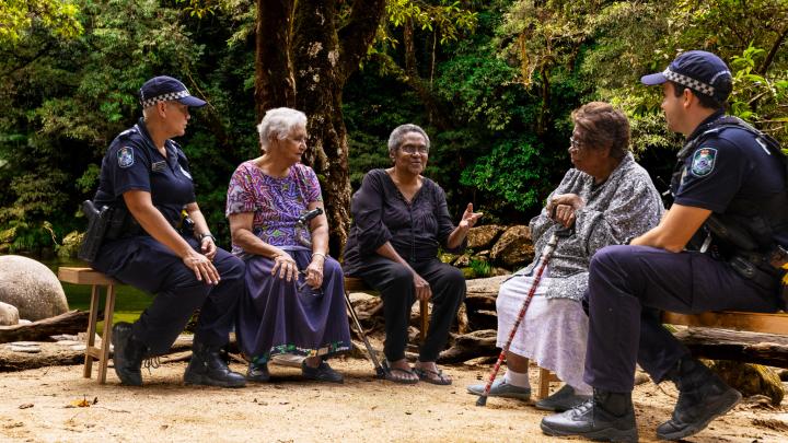 police officers having a yarn with elders