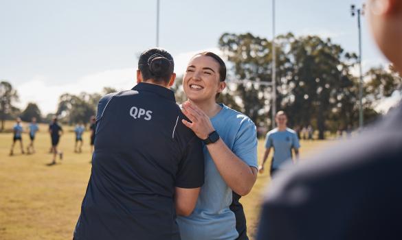 police officers embracing playing sport