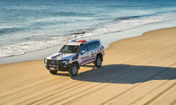 police vehicle on beach