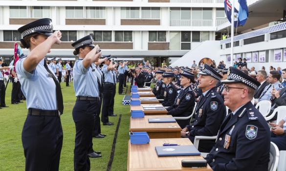 Recruit graduates saluting senior officers