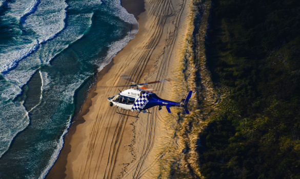 QPS PolAir flying over coastline