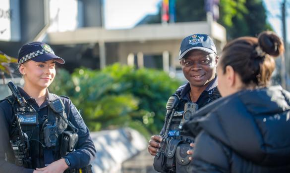 General duties police officers chatting with community member