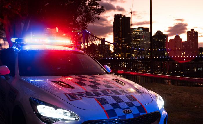Police vehicle with city in background