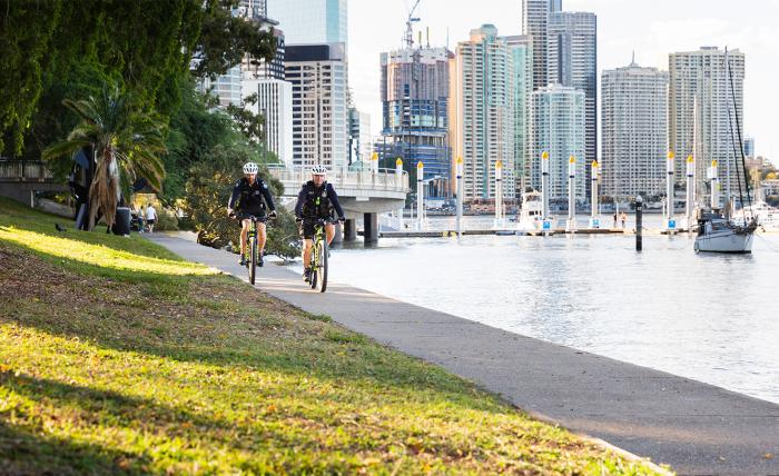 Two officers riding beside Brisbane River