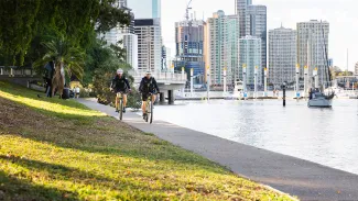 Two officers riding beside Brisbane River