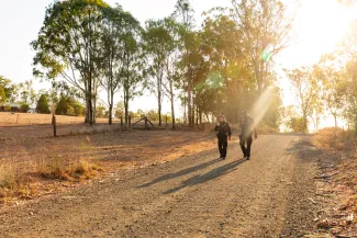 police officers walking on rural dirt road