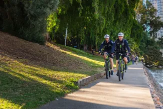 Bike squad police officers ride on Botanic Gardens path