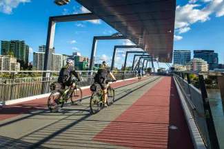 QPS bike squad riding over bridge in Brisbane city