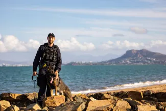 Police dog and handler near waterfront in Townsville
