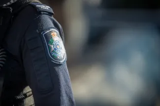 QPS badge on uniform sleeve
