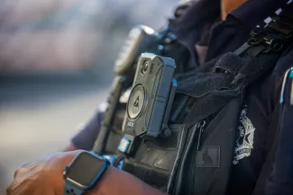 close up of body worn camera on police officer's vest