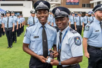 QPS Multicultural pathway recruit presented with badge at graduation