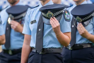 Recruit holding captains hat at graduation parade