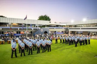 recruits on night graduation parade