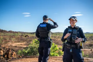police officers standing in remote queensland landscape