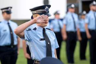 Recruit salutes at graduation